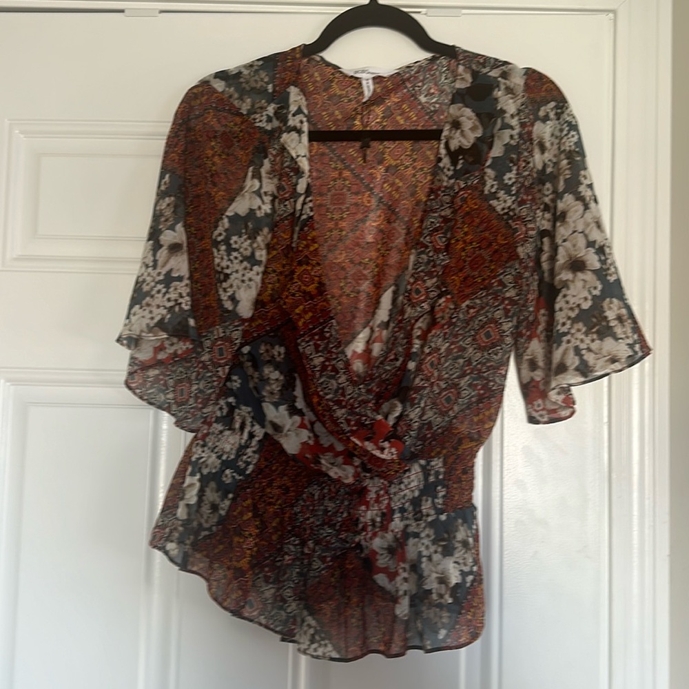 BCBGeneration size medium pattern blouse gathered waist wrap style